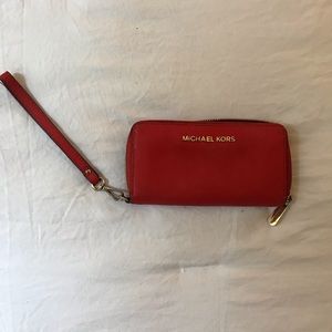 Orange Michael Kors wallet/clutch